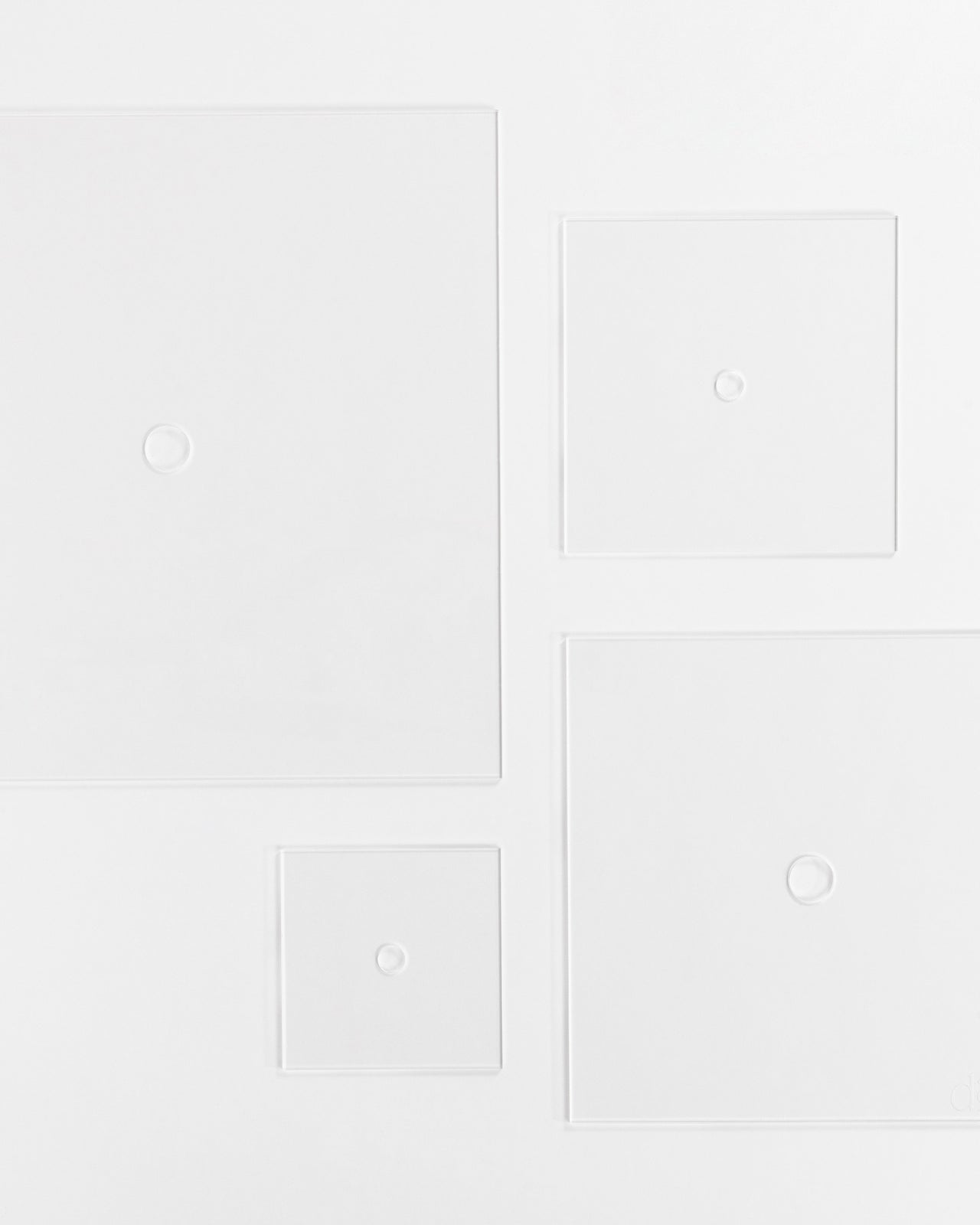 Food-safe acrylic cake board with central hole for tiered cakes.